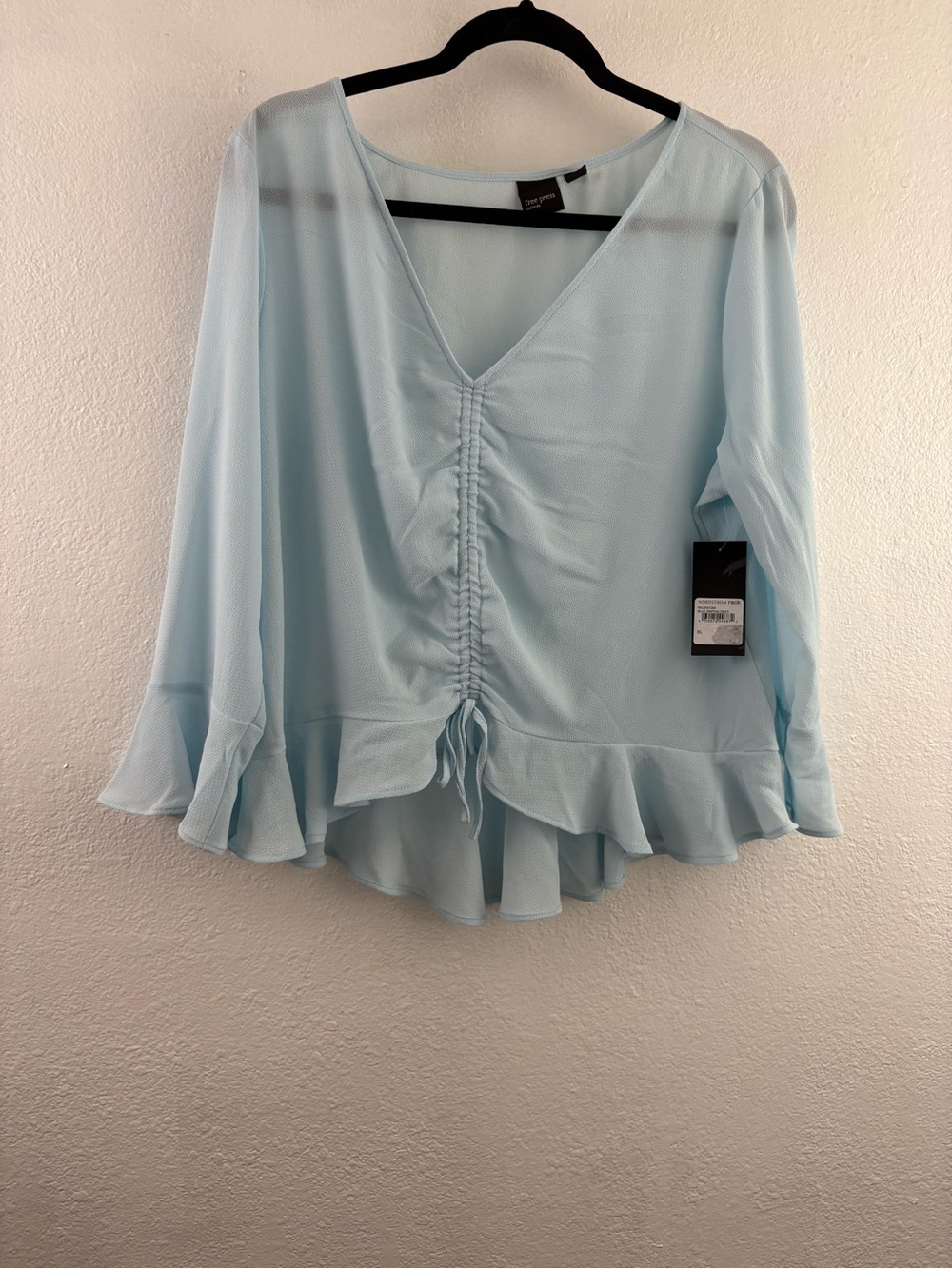 Free Press top features a light blue color, long sleeves, and a v-neckline XL